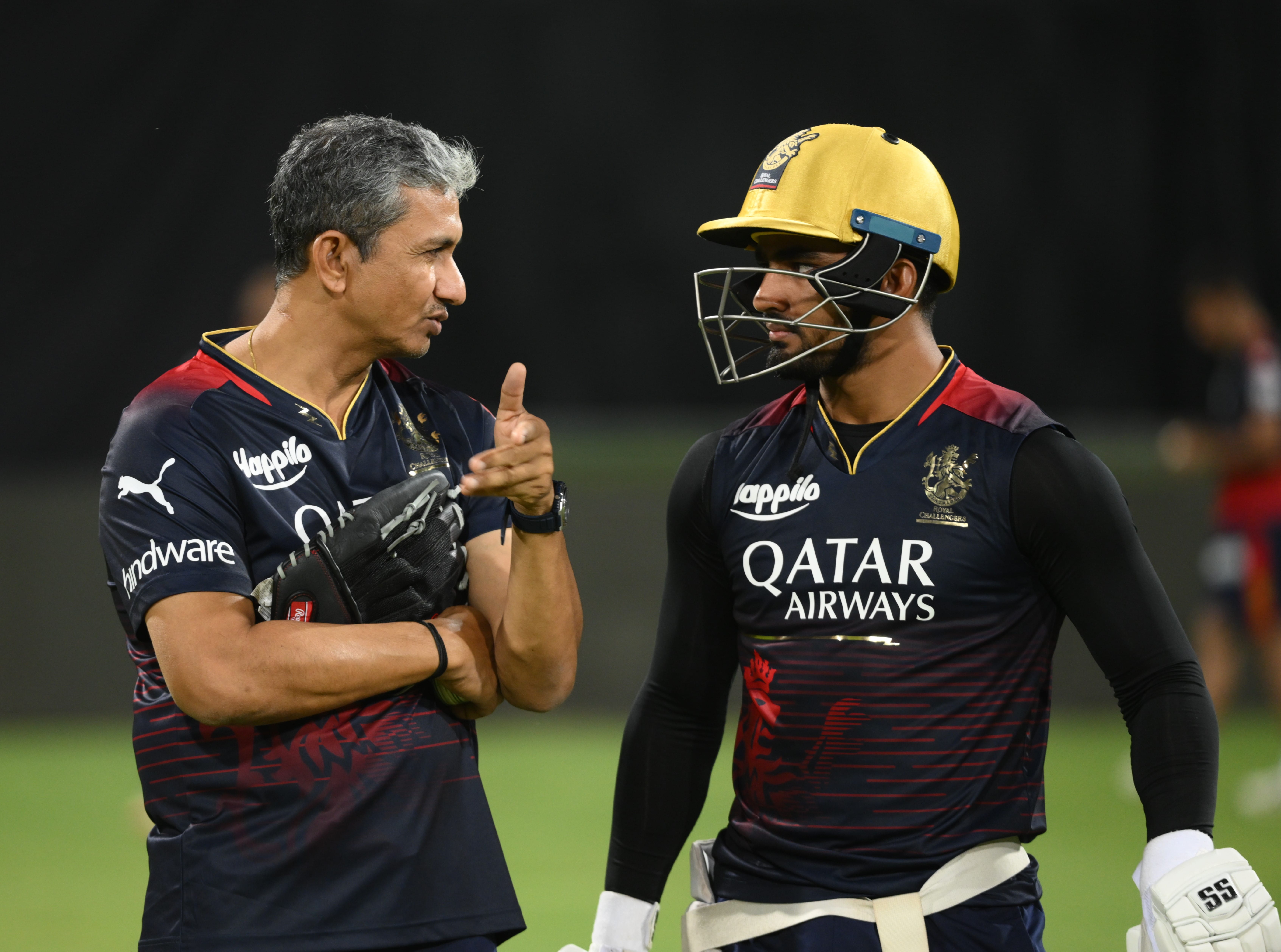 "RCB's fighting spirit and player development strategy are key to success," say coaches Sanjay Bangar and Mike Hesson