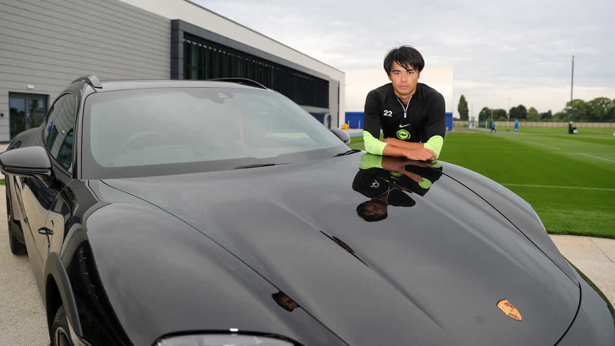 Kaoru Mitoma awarded a Porsche by Brighton for winning POTM award