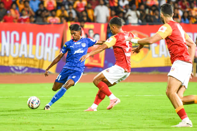 Which two unique records did Vinith Venkatesh achieve after scoring against East Bengal?