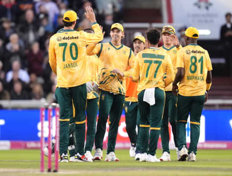 South Africa's Tristan Stubbs (centre, facing) celebrates after catching out England's Jos Buttler is caught out by following a ball by Bjorn Fortuin during the second International T20 Match at Emirates Old Trafford, Manchester. Picture date: Friday September 12, 2025. (Photo by Nick Potts/PA Images via Getty Images)