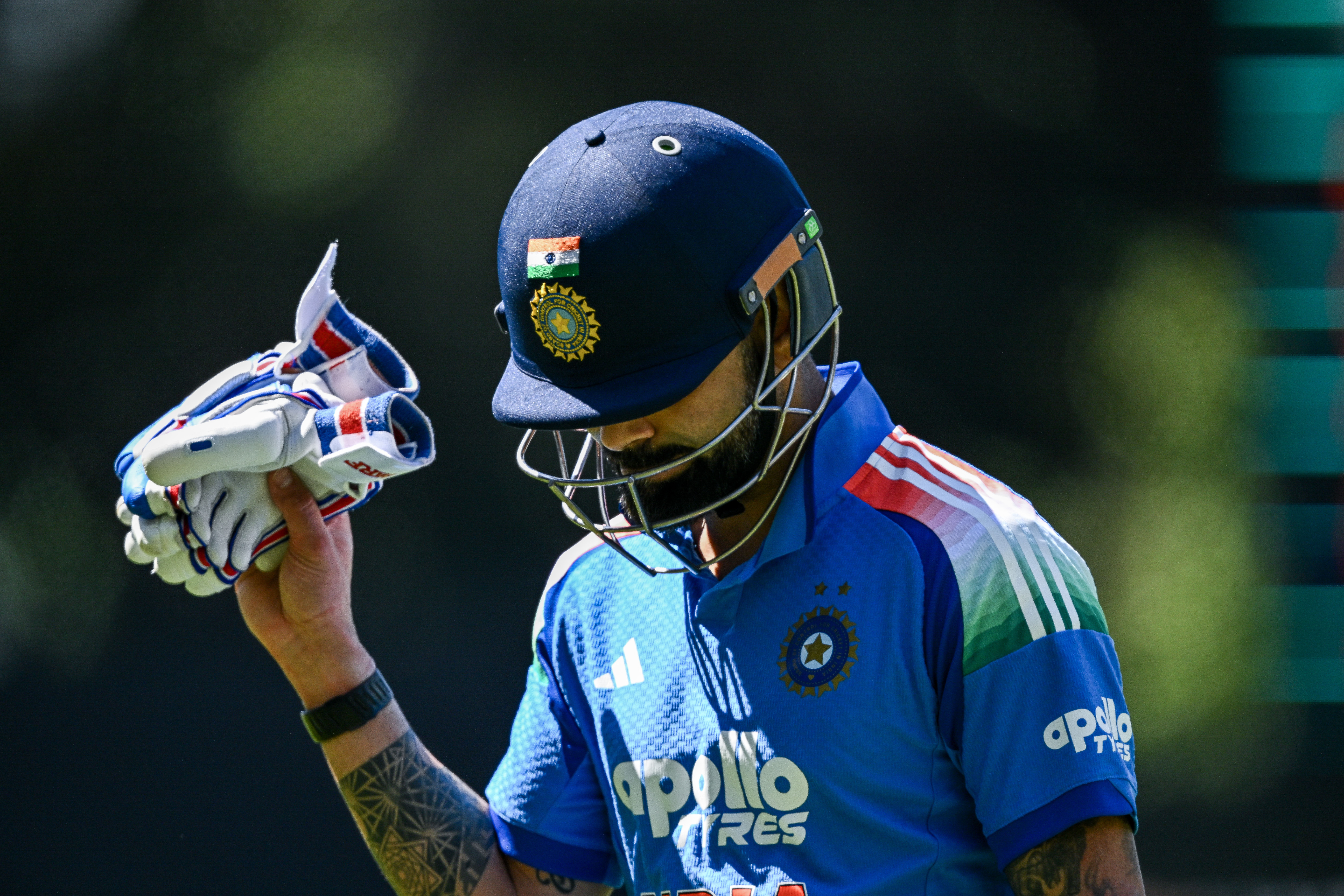Virat Kohli head down gloves up