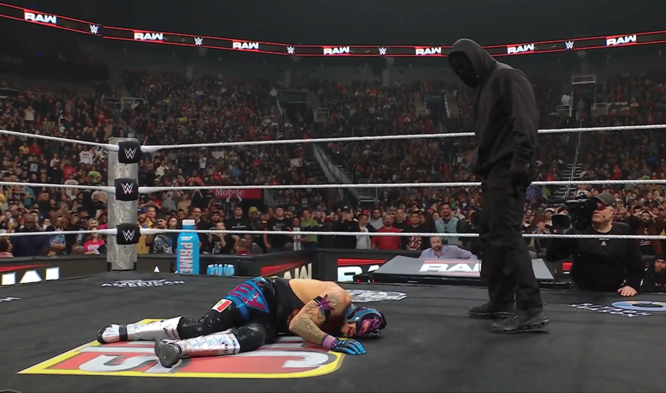 Who was masked man attacking Rey Mysterio & LA Knight on WWE RAW?