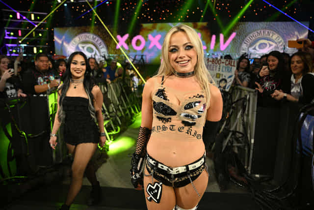 Liv Morgan enters the arena accompanied by Roxanne Perez during Monday Night WWE RAW Night of Champions 2026 Money in the Bank 2026