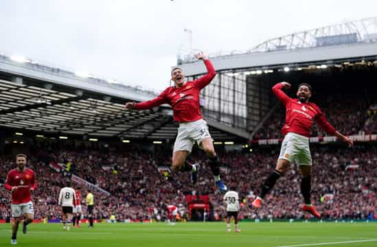 Benjamin Sesko of Manchester United celebrates scoring their second goal with Matheus Cunha
