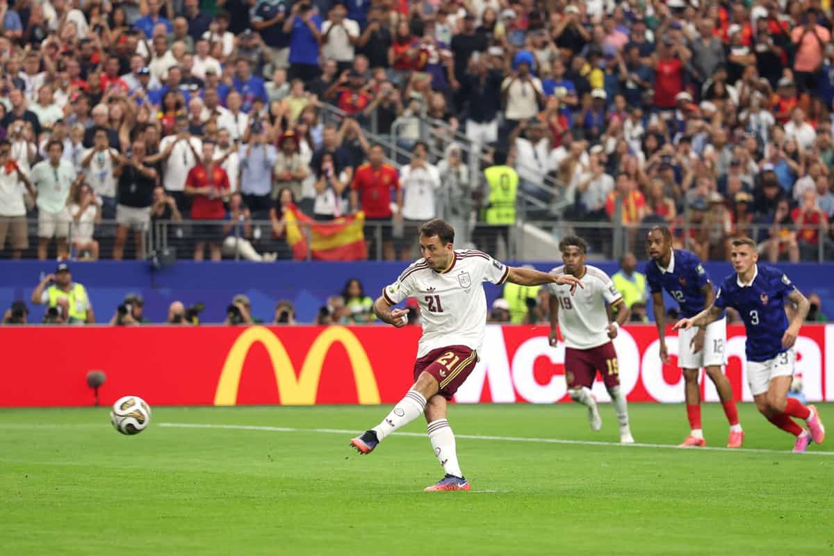 ARLINGTON, TEXAS - JULY 14: Mikel Oyarzabal #21 of Spain converts a penalty to score his team's first goal during the FIFA World Cup 2026 Semi Final match between France and Spain at Dallas Stadium on July 14, 2026 in Arlington, Texas. (Photo by Lars Baron/Getty Images)