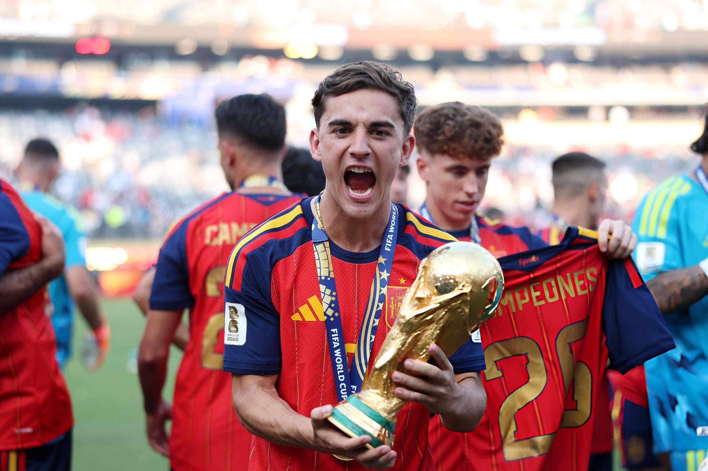 EAST RUTHERFORD, NEW JERSEY - JULY 19: Gavi #9 of Spain celebrates with the FIFA World Cup Winner's Trophy after the team’s victory following the FIFA World Cup 2026 Final match between Spain and Argentina at New York New Jersey Stadium on July 19, 2026 in East Rutherford, New Jersey. (Photo by Alex Pantling - FIFA/FIFA via Getty Images)